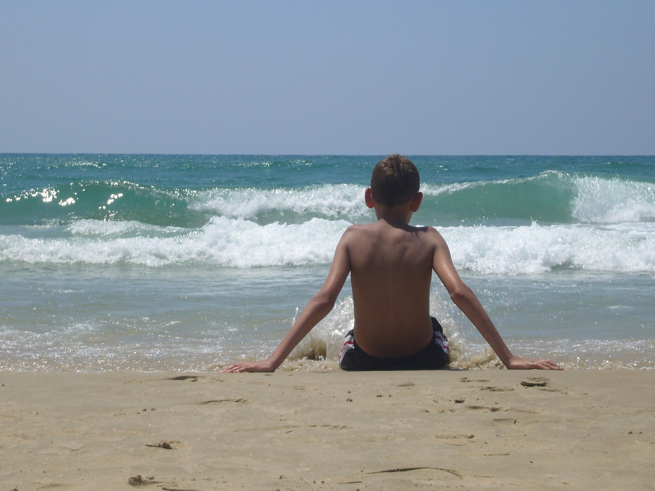 boy beach watch sit free photo