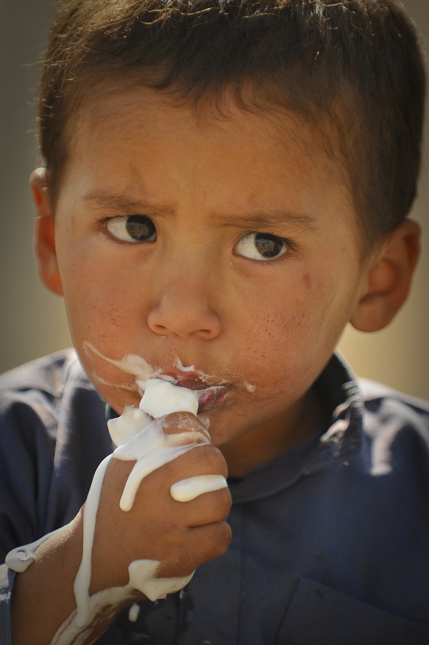 boy eating ice cream free photo