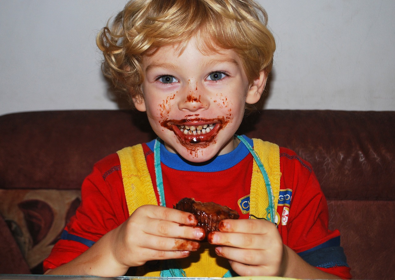 boy eating chocolate free photo