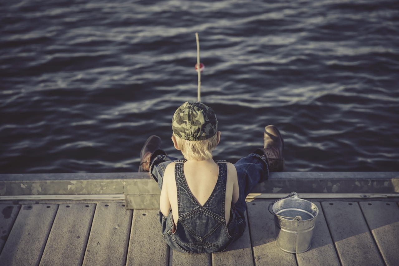 boy fishing water free photo