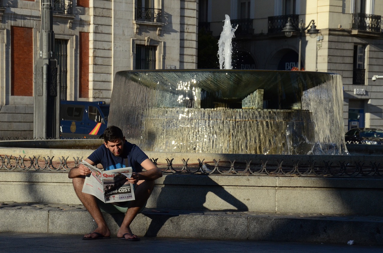 boy reading newspaper newspaper reading free photo