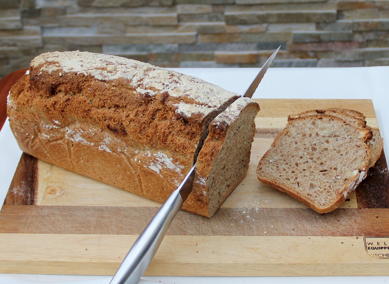 bread cutting fresh bread homemade free photo