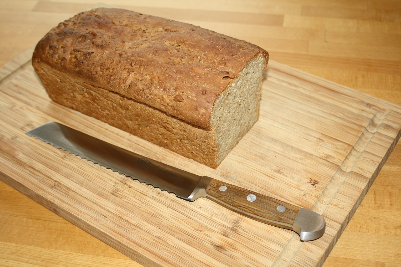bread knife oak handle loaf of bread free photo