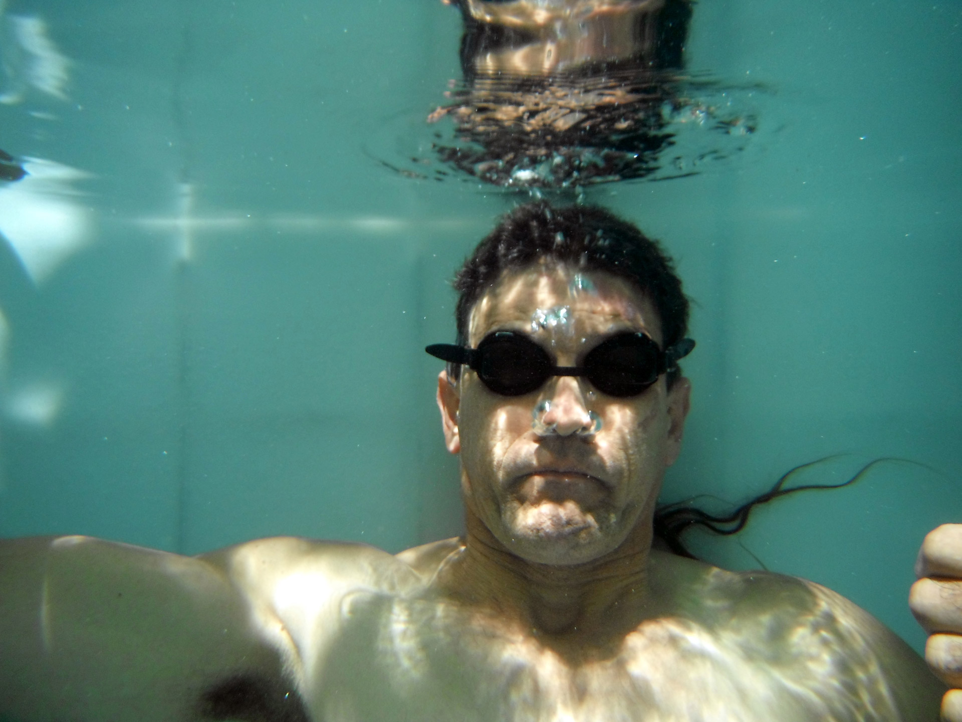 underwater swimming man free photo