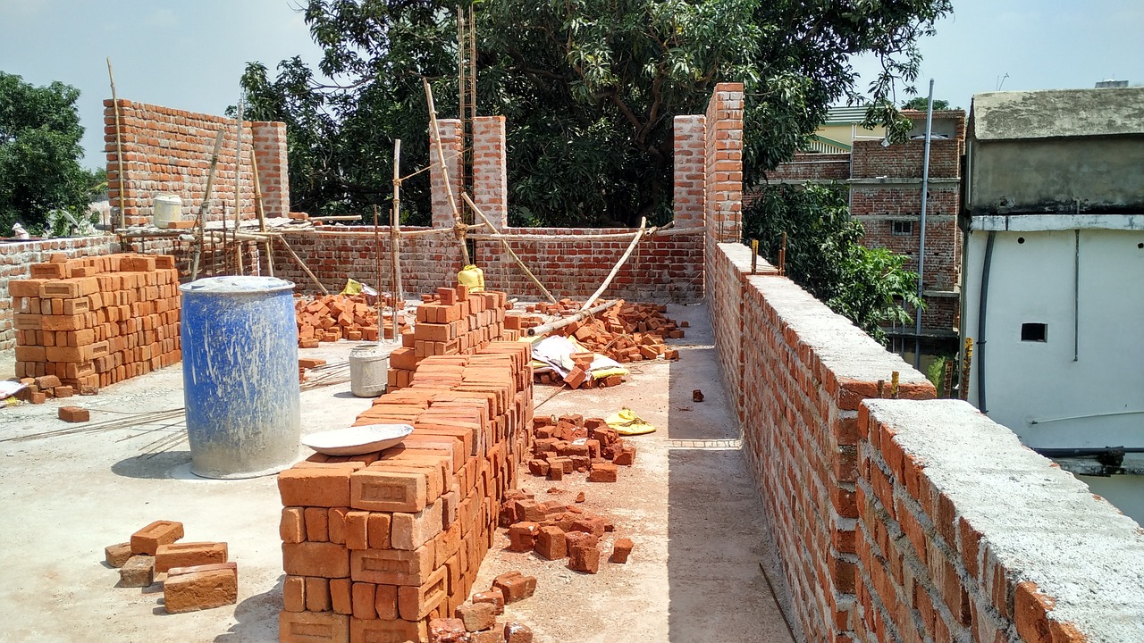 bricks on he roof construction views red bricks free photo