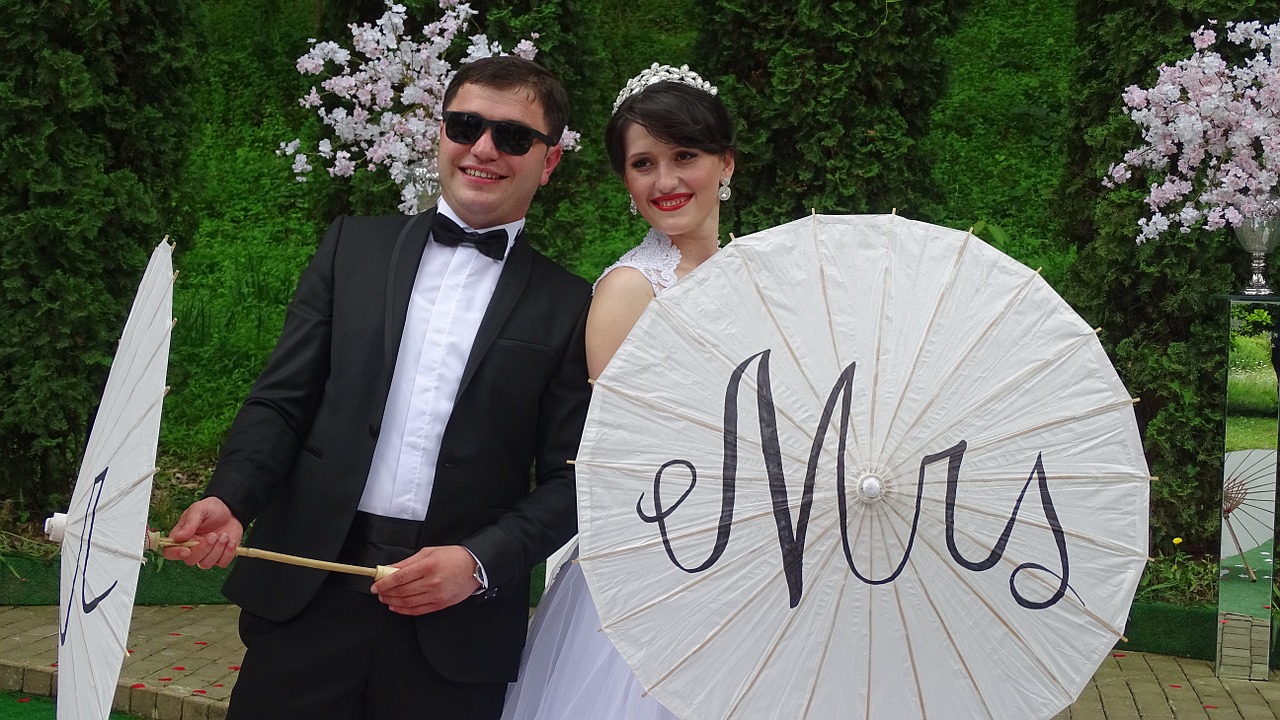 bride and groom wedding umbrella free photo
