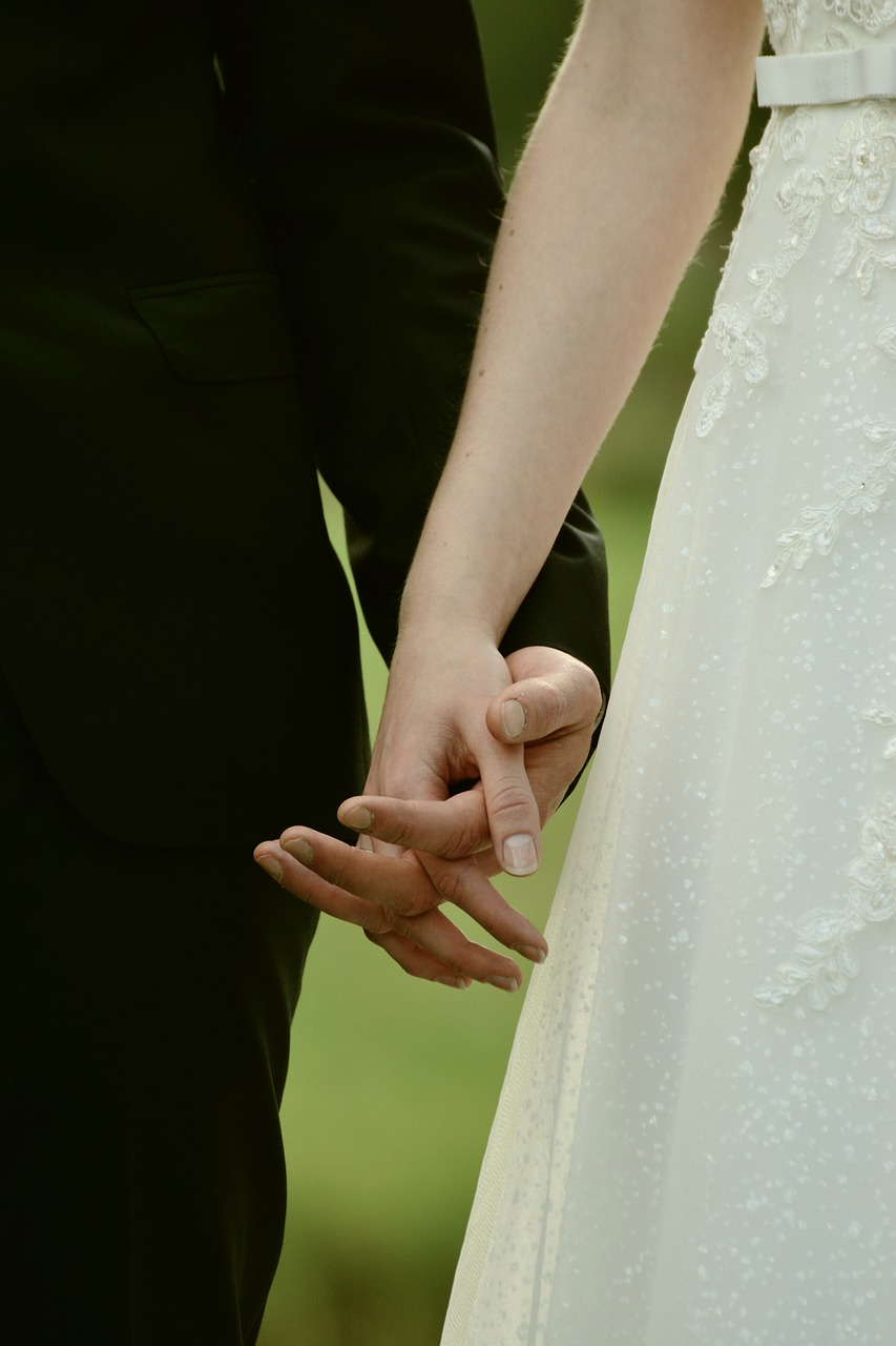 bride and groom hands together free photo