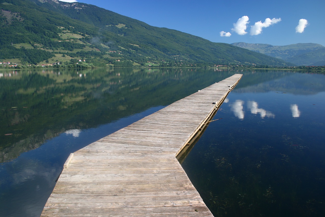 bridge lake reflected in water free photo