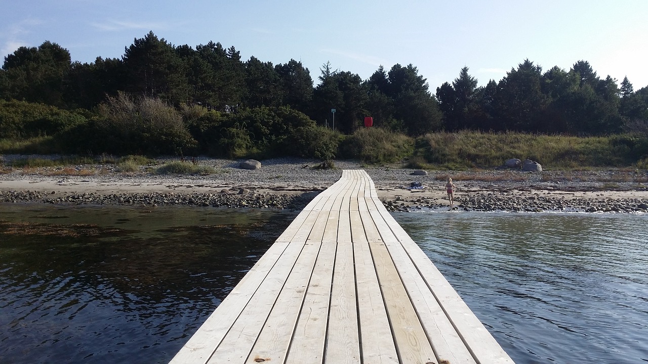 wooden bridge sandy beach vollerup beach free photo