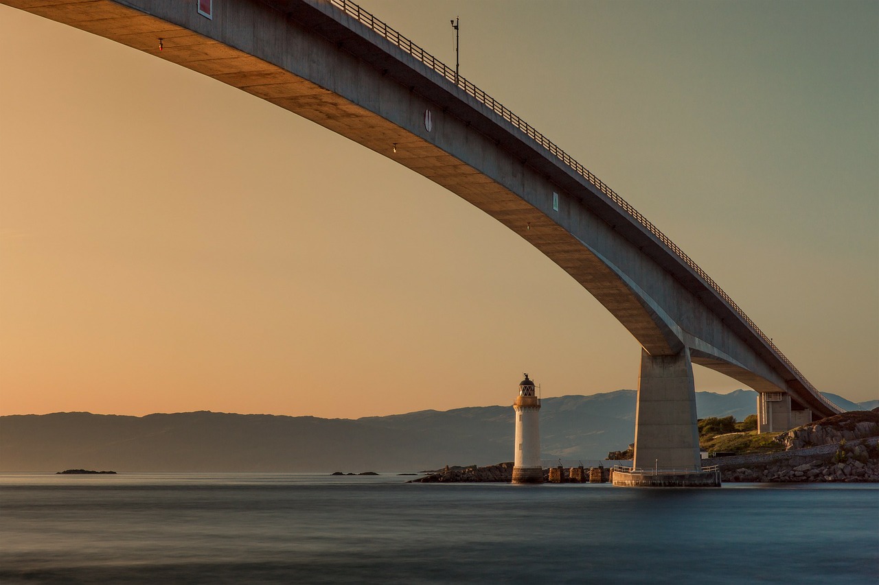 bridge lighthouse sunset free photo