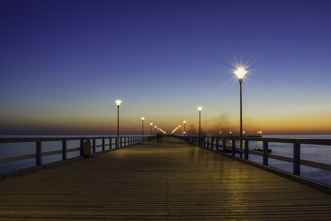 bridge  sunset  sea free photo