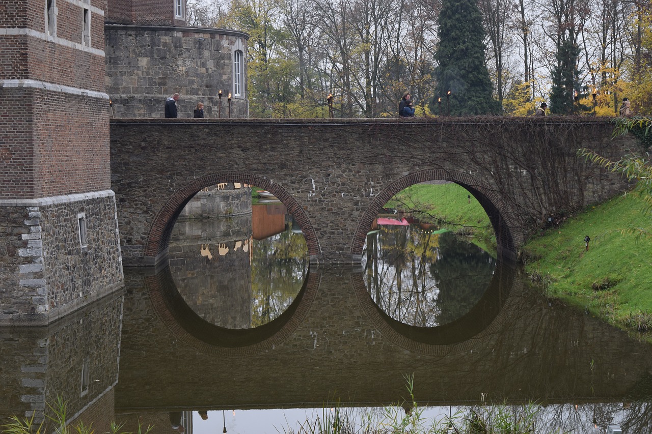 bridge mirroring water free photo