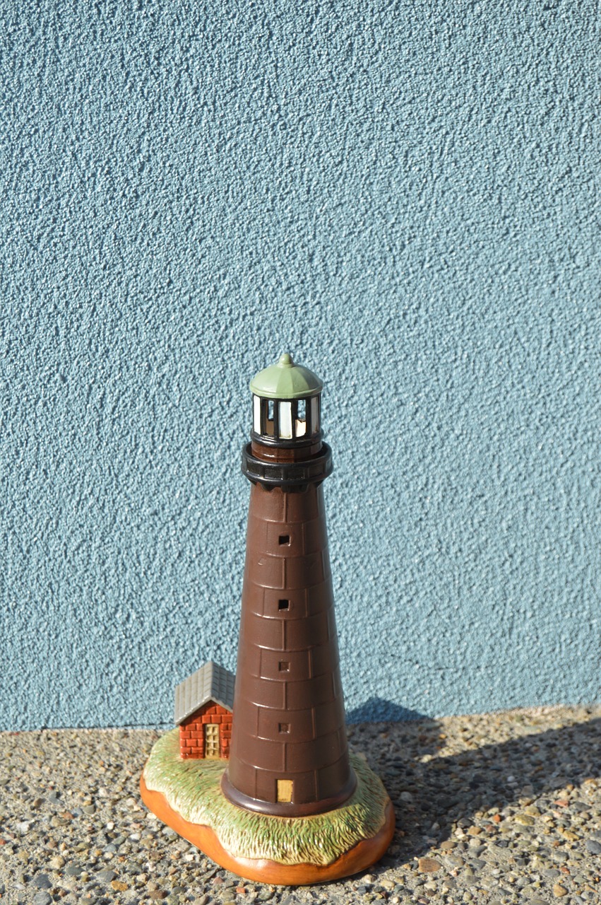 brown lighthouse lighthouse statue architecture free photo