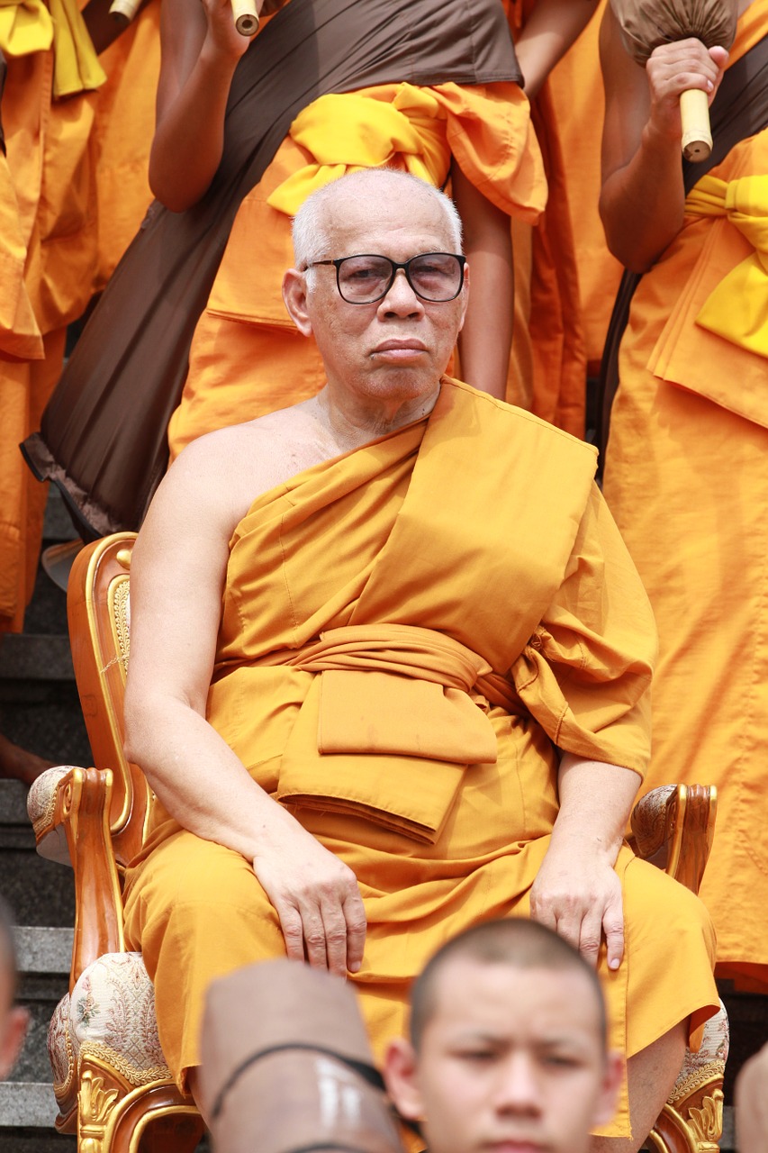 buddhists monks sitting free photo