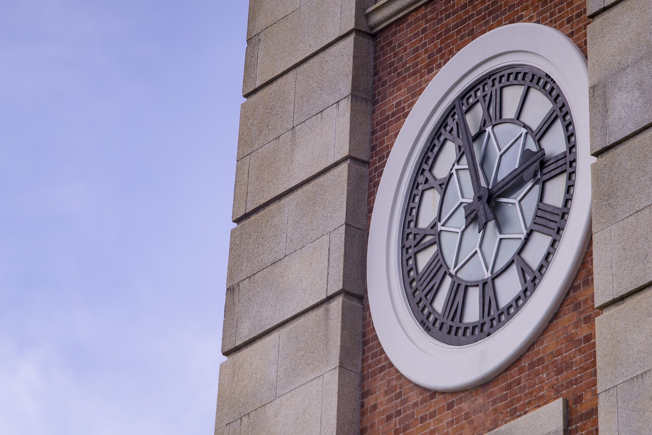 building  clock  sky free photo