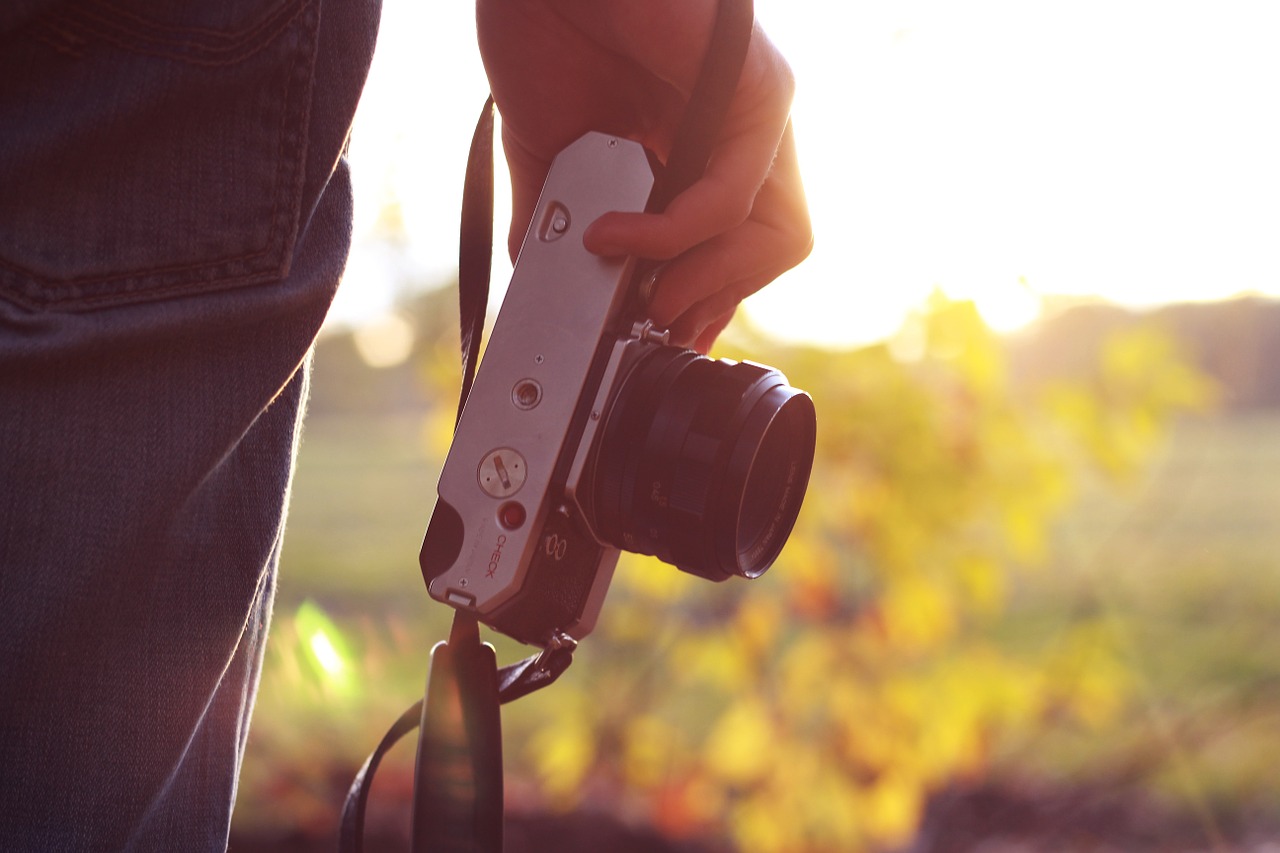 camera holding person free photo