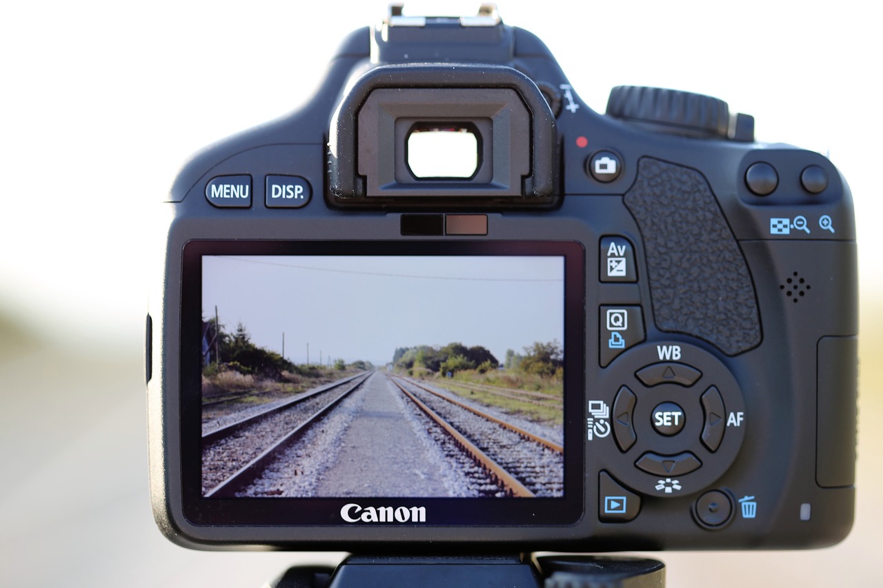 camera on railway photo on rail far distance free photo