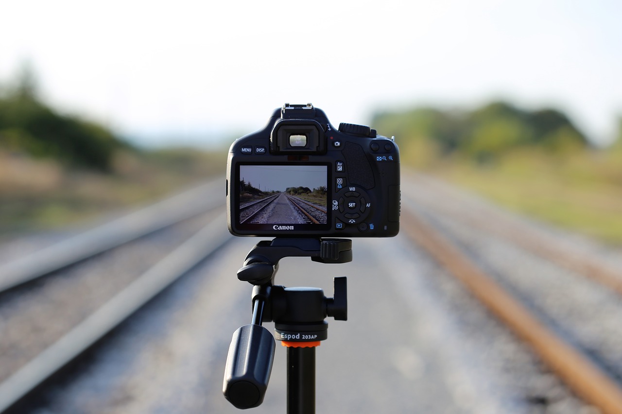 camera on railway photo on rail far distance free photo