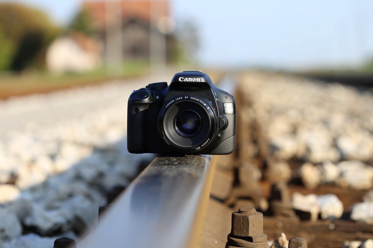 camera on railway photo on rail far distance free photo