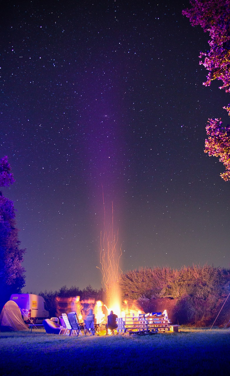campfire starry sky star free photo