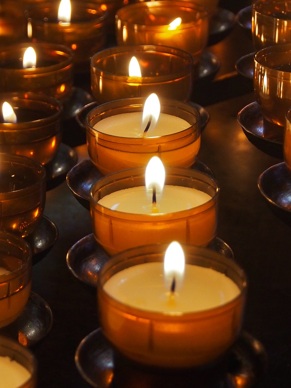 candle  votive light  religion free photo