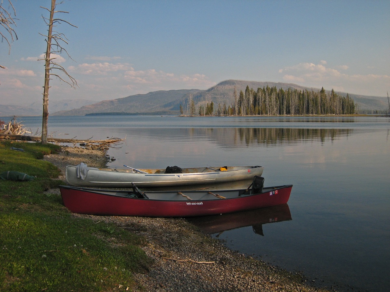 canoes beached lake free photo