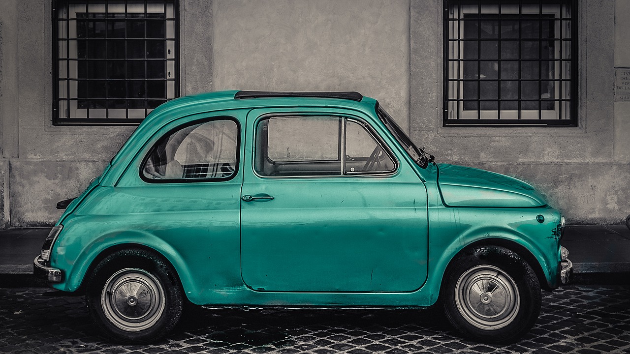 car front of a window green free photo