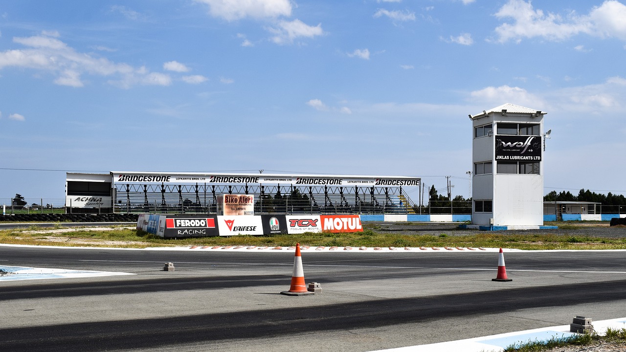 car racing track stands tower free photo