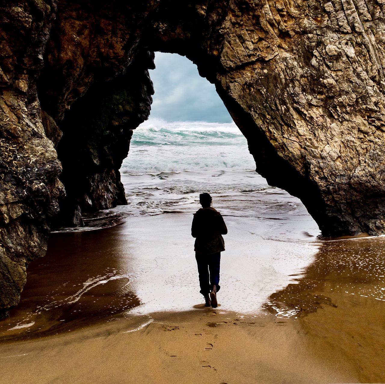 cave body of water side free photo