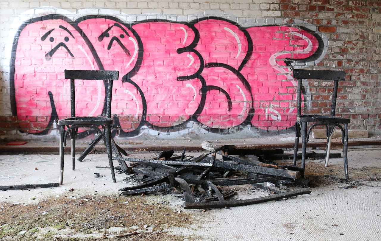 chairs  burnt wood  graffiti free photo