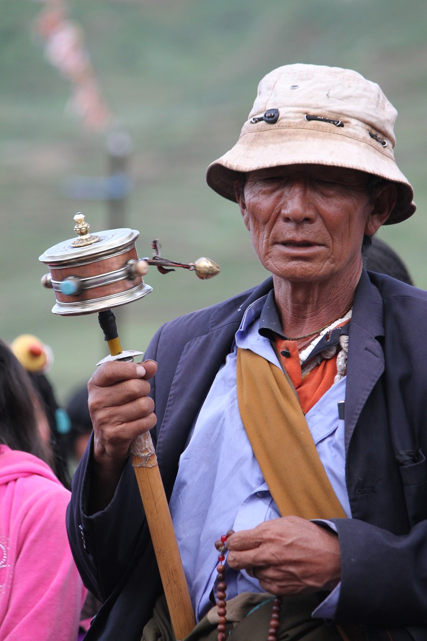 character turning the wheel tibet ethnic free photo