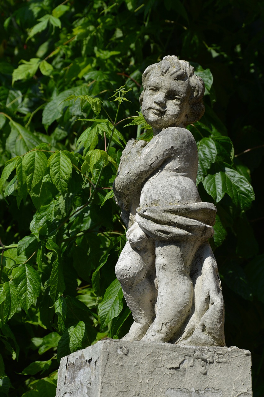 cherub statue greenery free photo