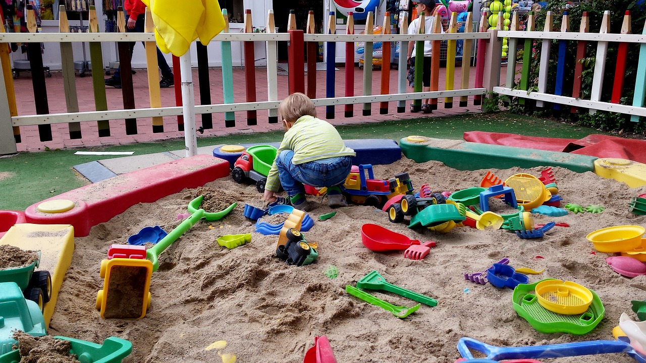 child sand pit play free photo
