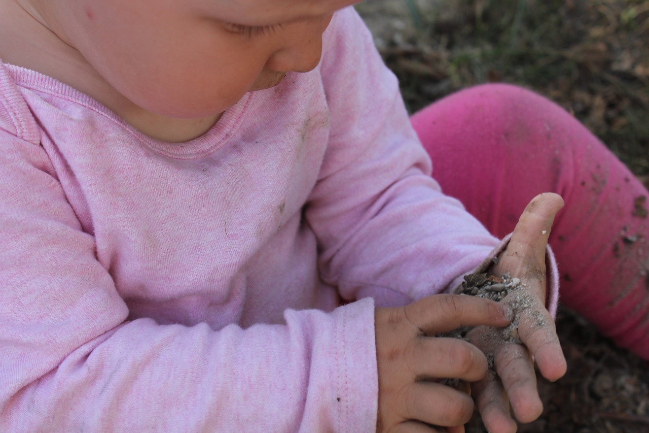 child hand stones free photo