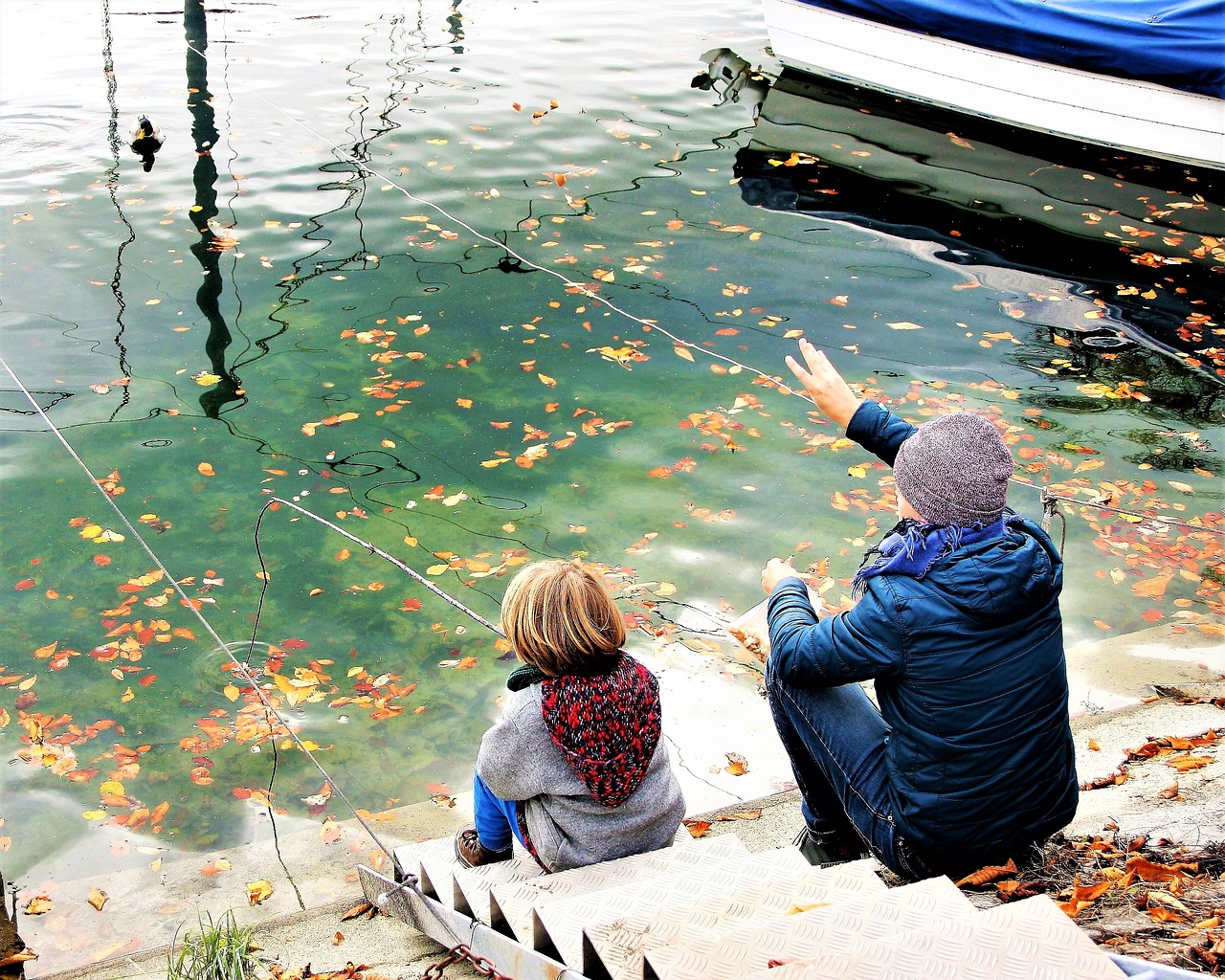 child father water surface free photo