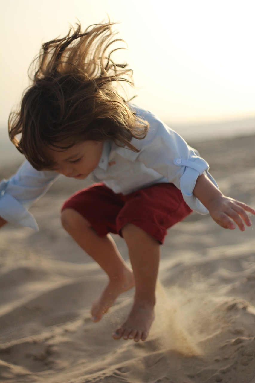 child  desert  jumping free photo