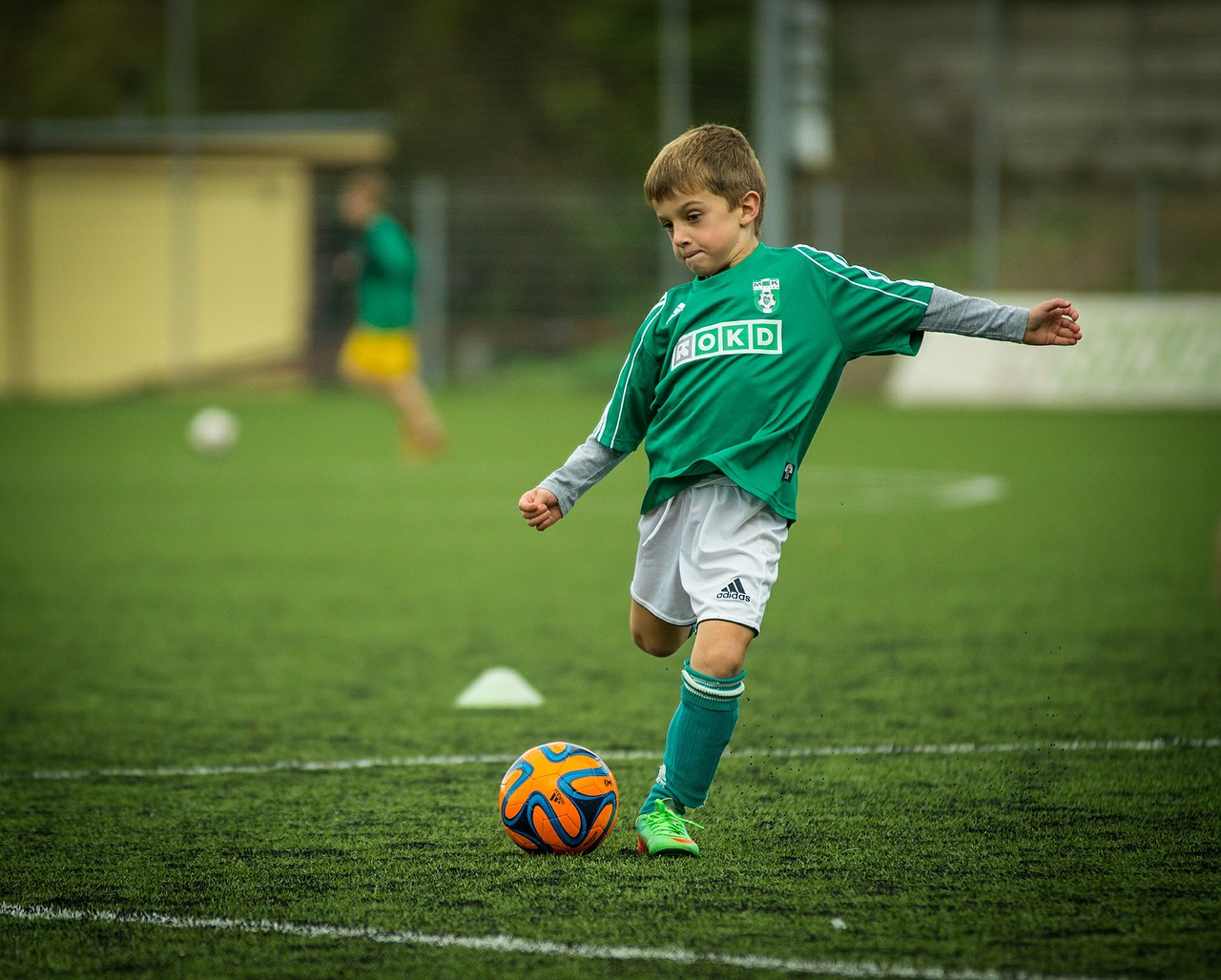 child footballer kick free photo