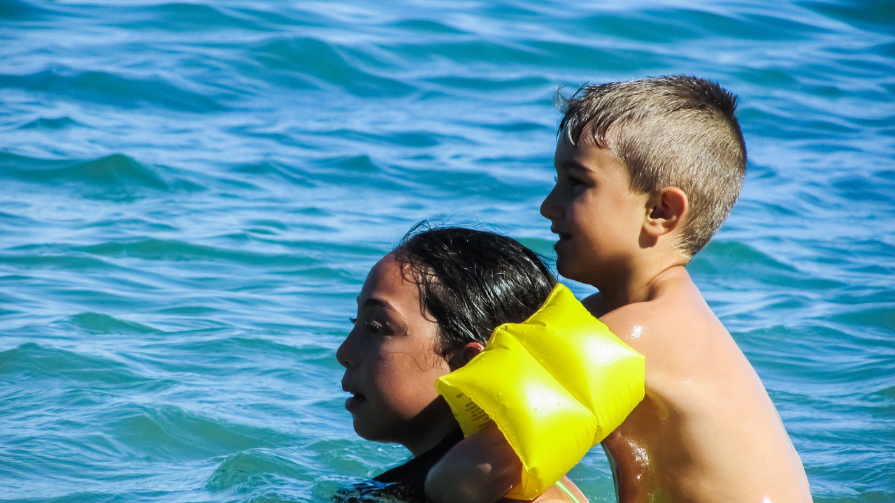 children swimming playing free photo