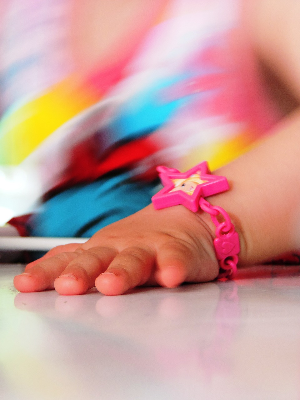 child's hand a children's toy bracelet free photo