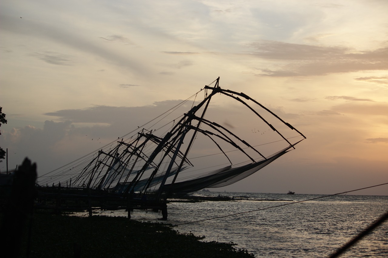 chinese fishing nets sunset kerala free photo