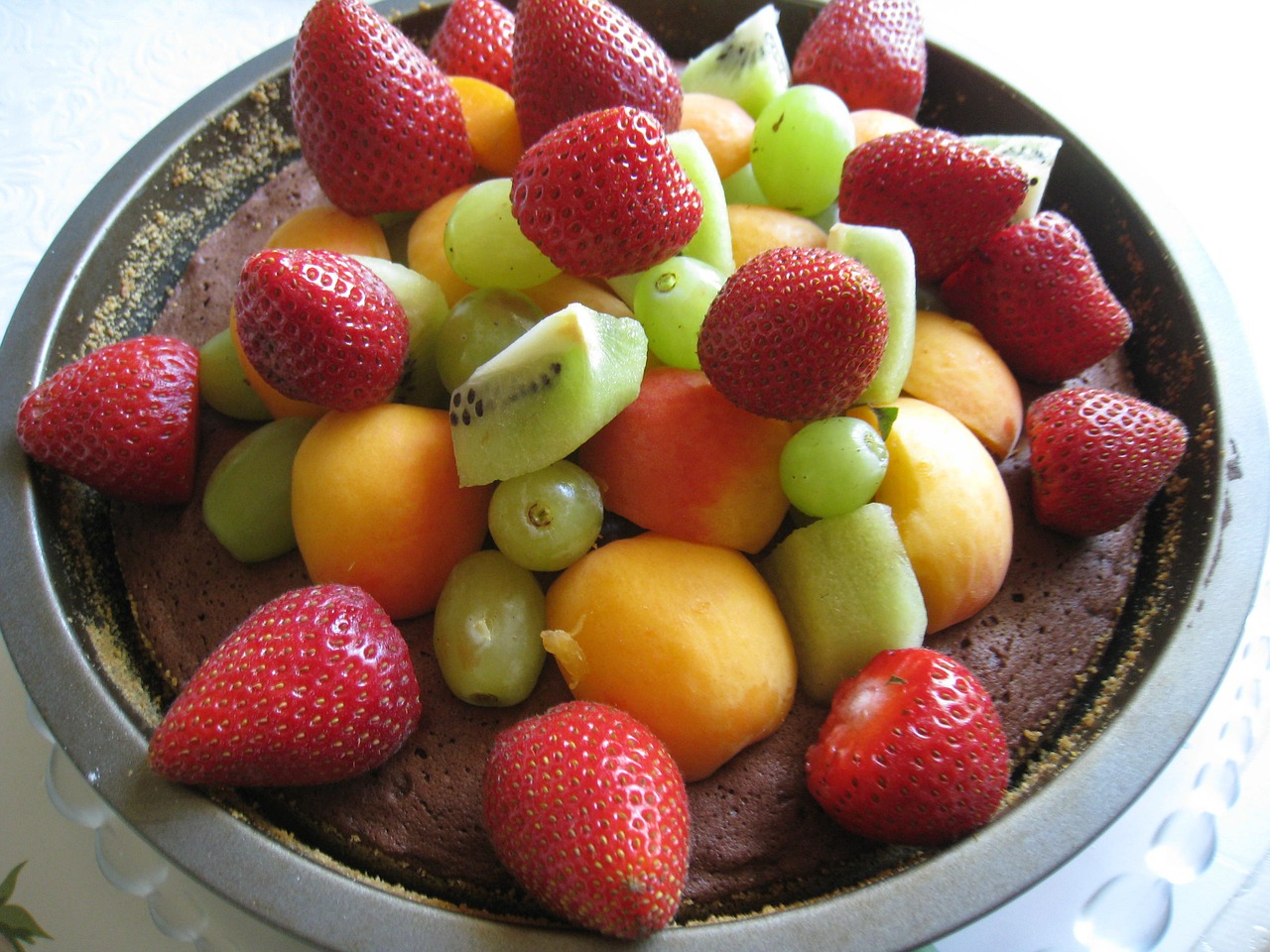 chocolate cake with fruit mountain colors fruits free photo