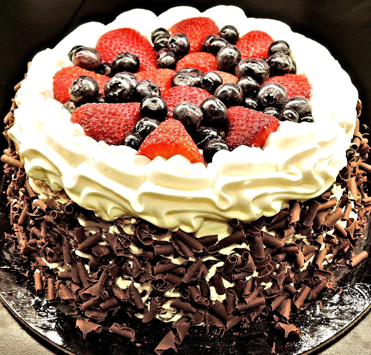 chocolate layer cake chocolate shavings strawberries free photo