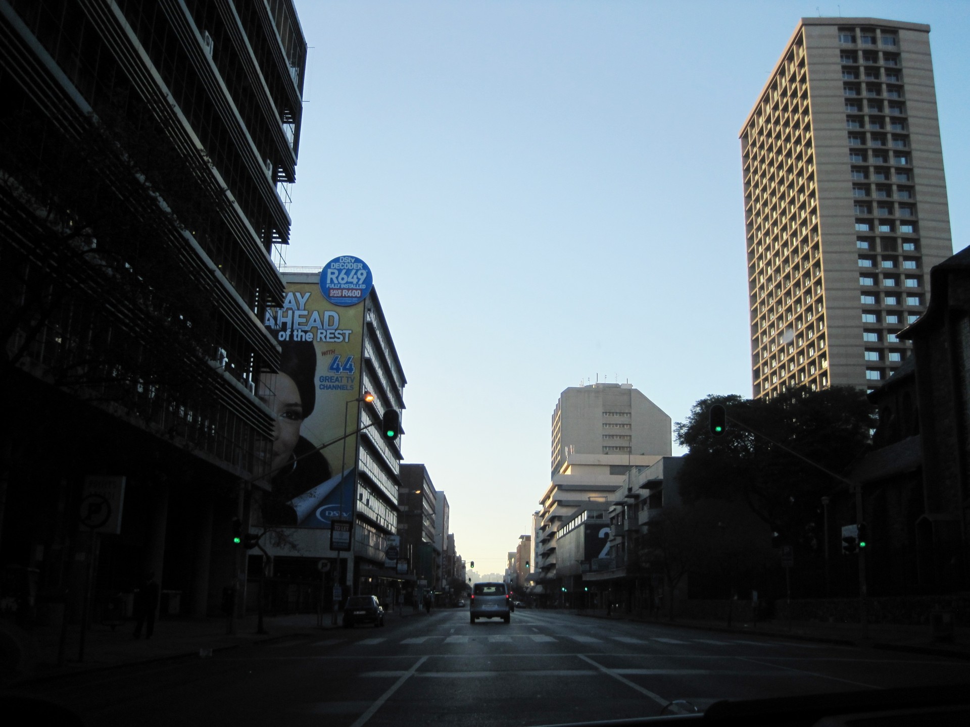 early morning street highrise buildings free photo