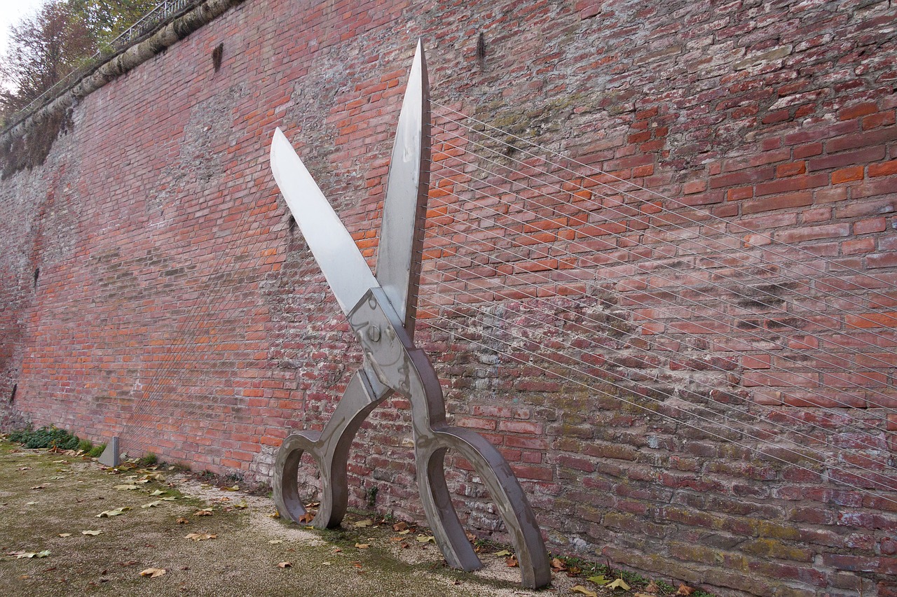 city wall sculpture scissors free photo