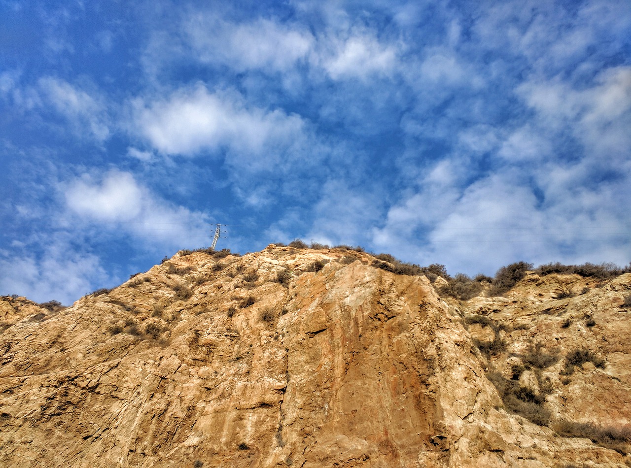 cliff sky pylon free photo