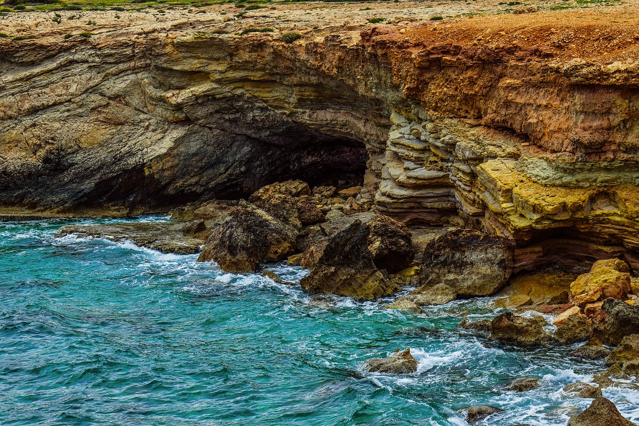 cliff rocky coast sea caves free photo