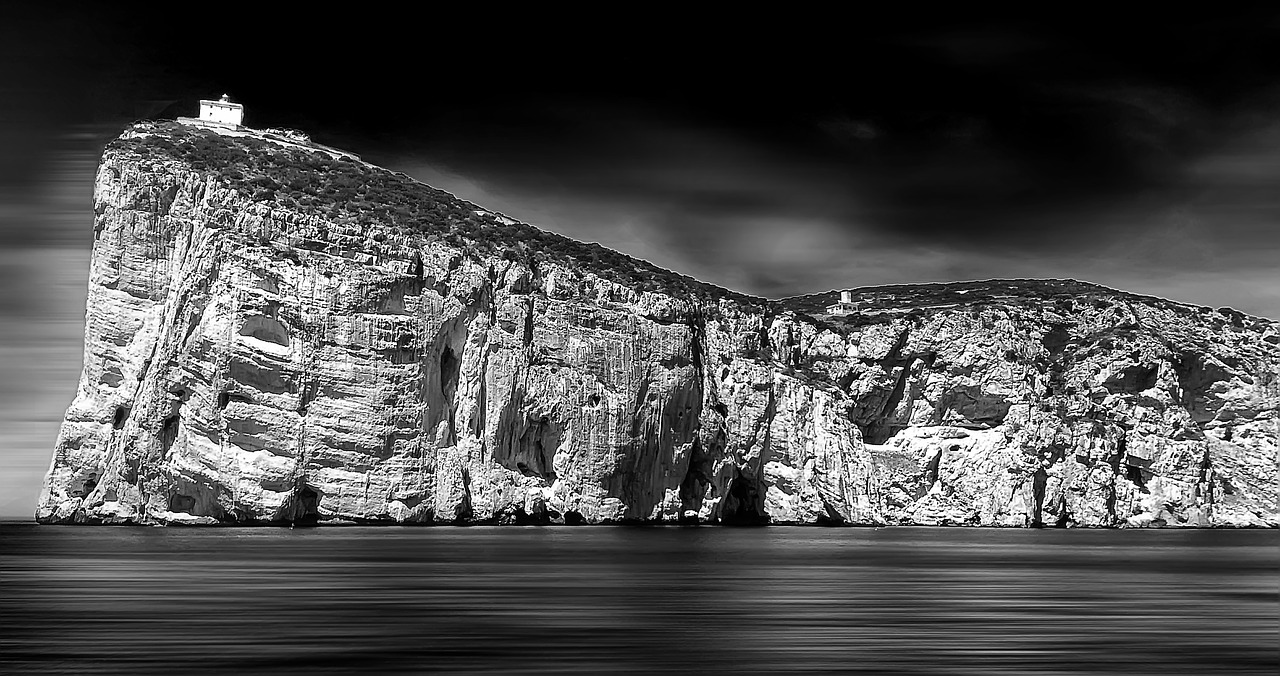 cliff rocks lighthouse free photo