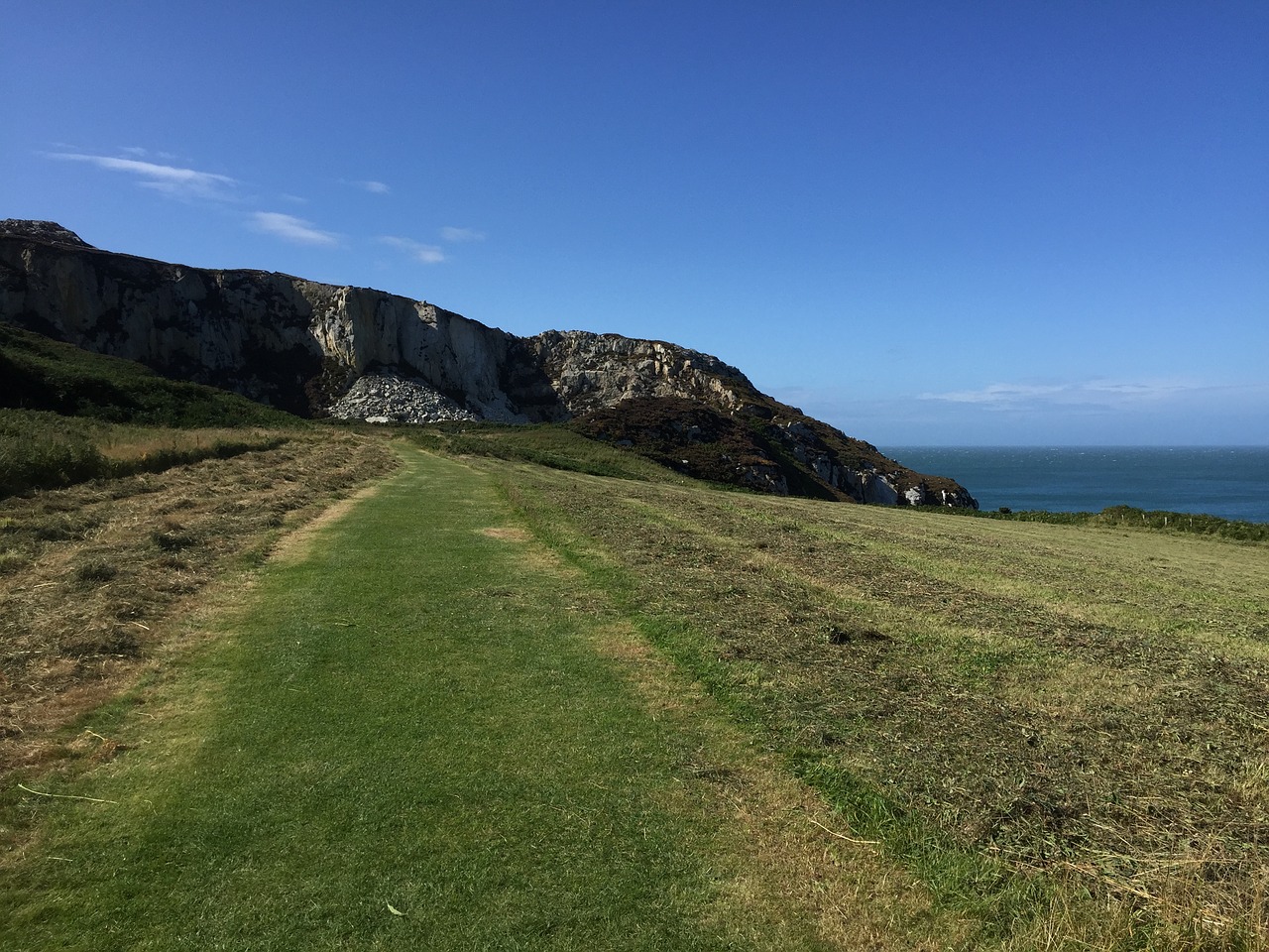 cliffs blue sky grass free photo