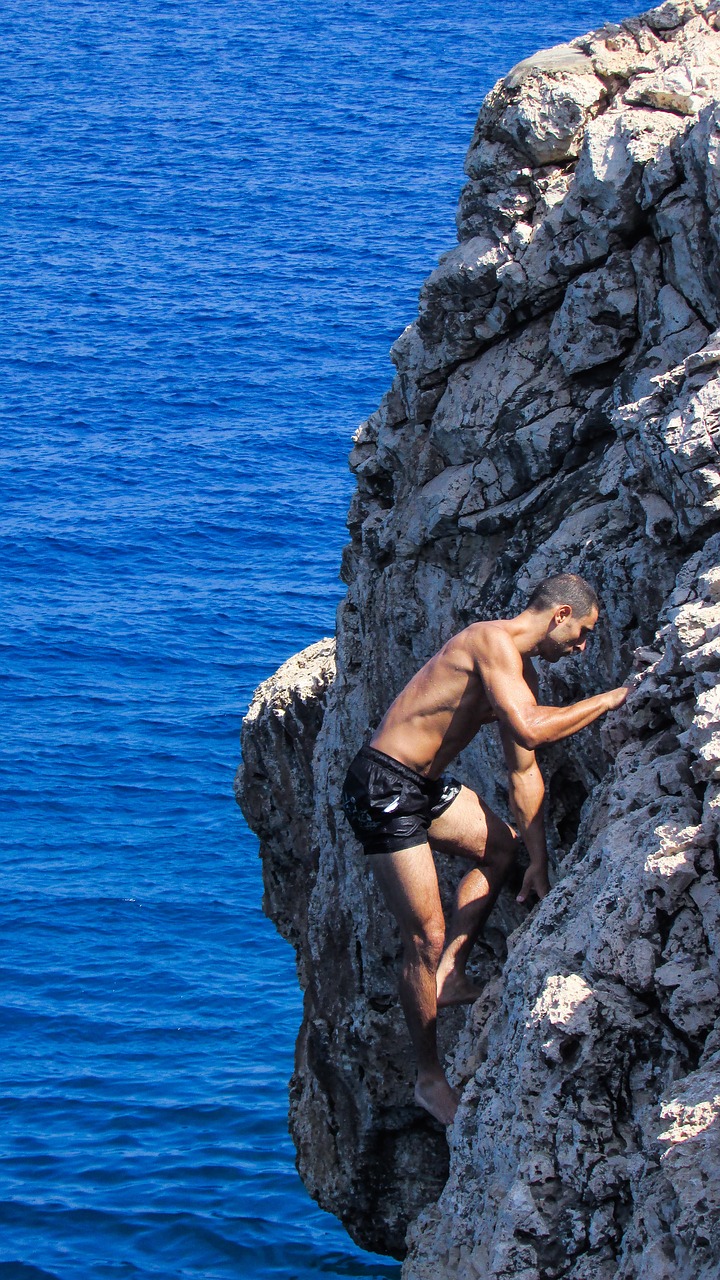 climbing rock sea free photo
