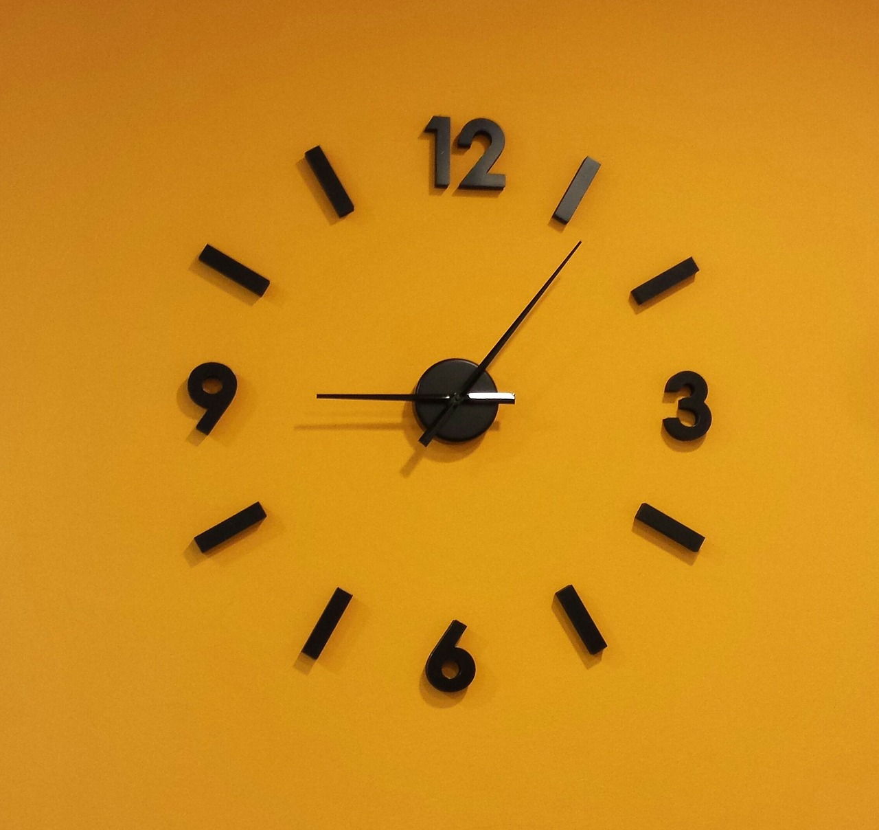 clock orange wall free photo